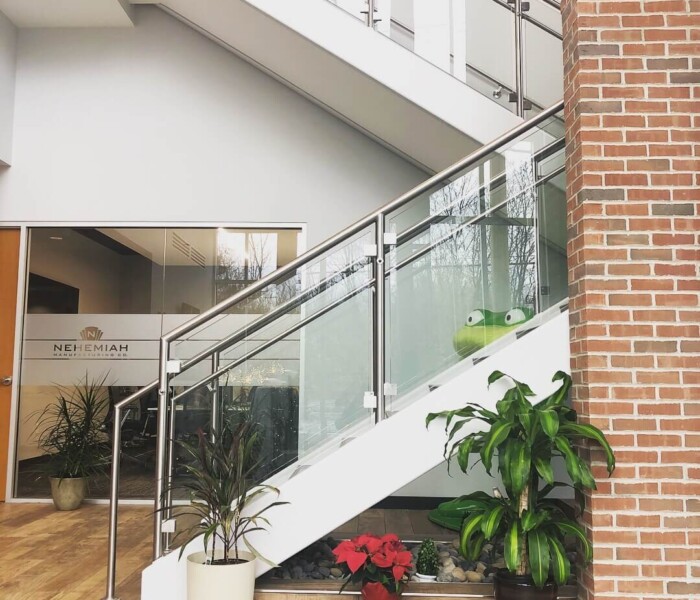 A side view of Interior Glass Railing for a commercial building, nehemiah.