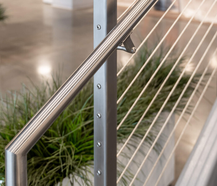 Close up view of ornamental railings with cable infill.