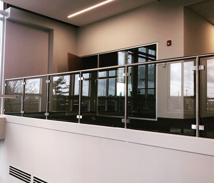 Custom Glass Railing manufactured by Alumina Railing for an interior commercial project.