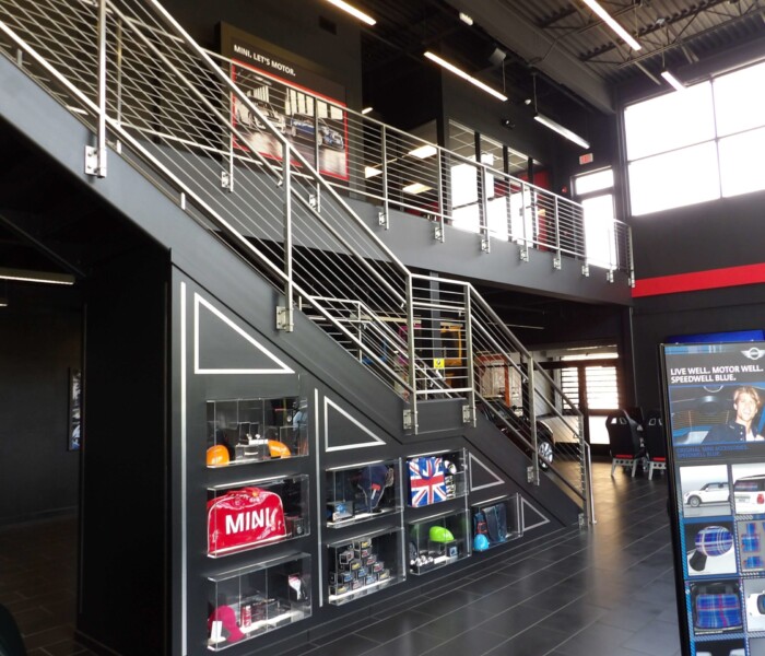 architectural railings with cable infill, stainless steel posts and handrail.
